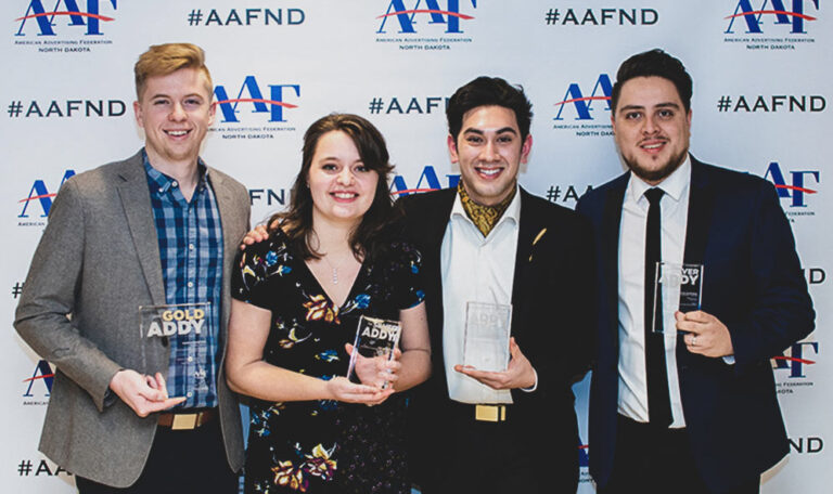 Jonathan Calix and Team Abovo receiving awards AAF